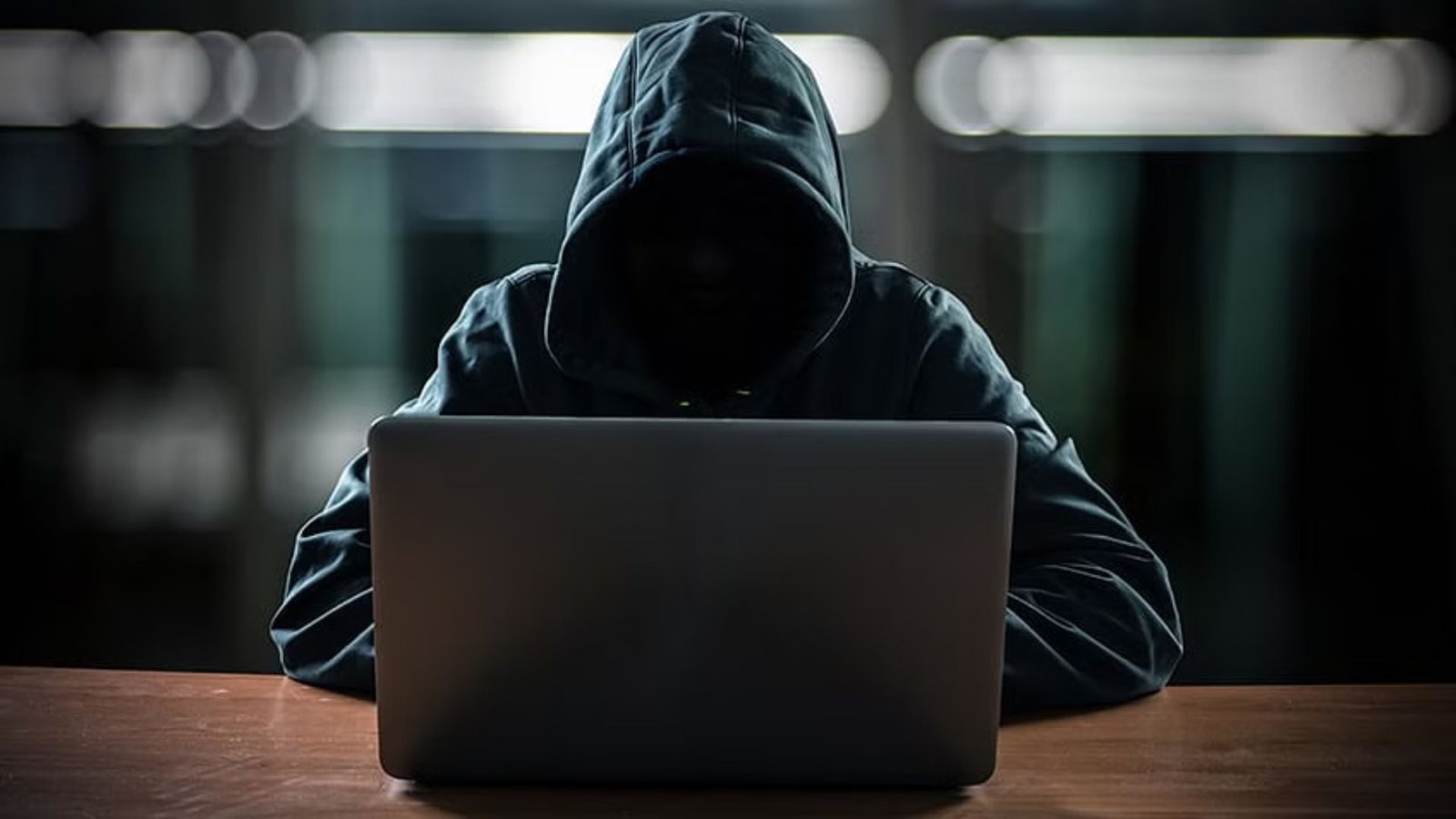 man hacking inside a laptop